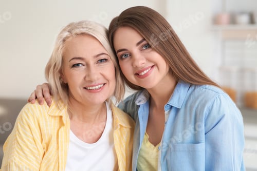 Preview: Portrait of young woman with her mature mother indoors