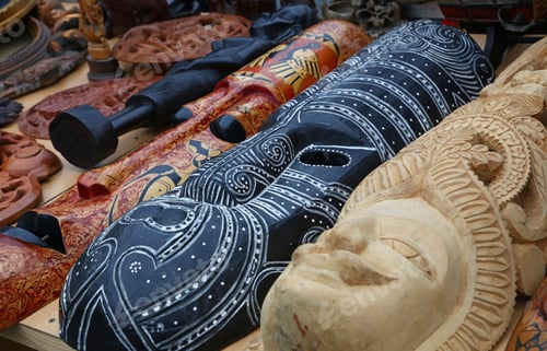 Vista previa: Ethnic wooden carved masks on retail market