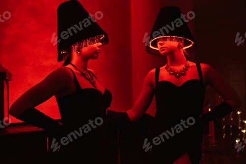 Preview: model girls in black dresses with illuminated floor lamps
