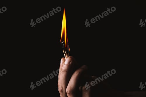 Preview: Burning match in the man's hand. Dangerous game with fire.