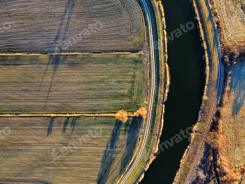 Preview: Drone shot of a river in a field
