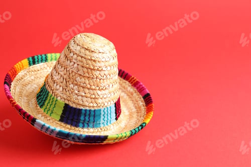 Preview: One Mexican sombrero hat on red background. Space for text