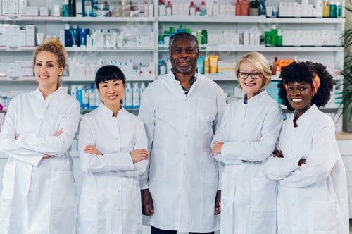 Preview: Portrait of five multicultural pharmacists in pharmacy.