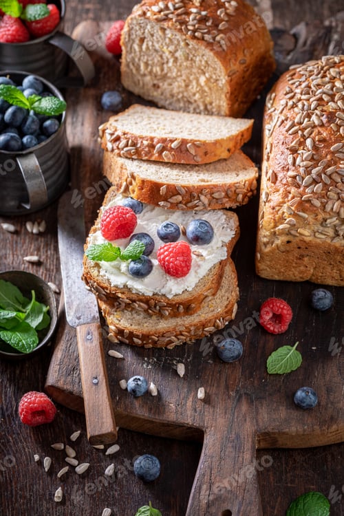 Preview: Tasty and fresh bread with cheese, mint and berries.