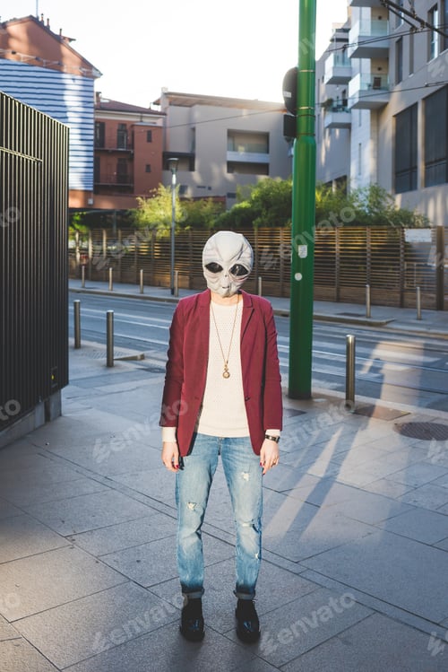 Preview: Woman wearing alien mask