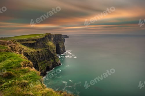 Preview: Scenic view of a beautiful seascape in a colorful sunset sky background in Ireland