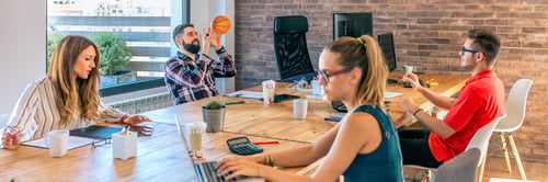 Preview: Businessmen having fun playing with a basket ball in coworking office