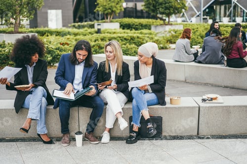 Preview: Multiethnic business people doing lunch break outdoor from office building