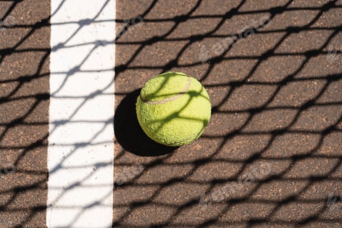 Preview: Yellow tennis ball on court