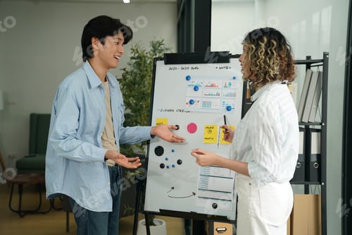 Preview: Shot of business people working with laptop and talking of they new project together in the office.