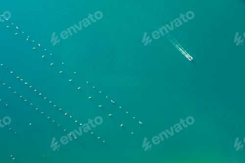 Preview: Oyster farm in Lim bay of Croatia with yacht sailing nearby