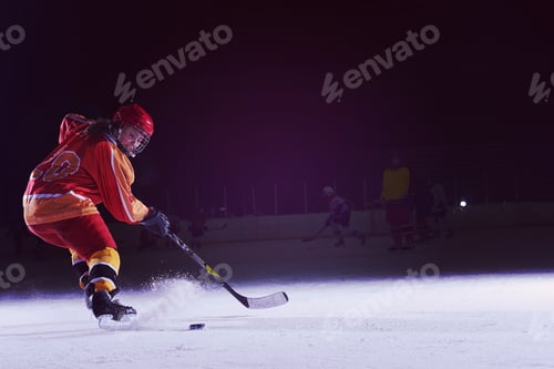 Preview: teen ice hockey player in action