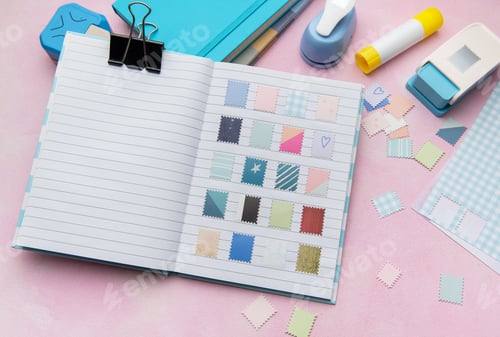 Preview: Scrapbook journal with decorative crafting paper punches creating diy stamps