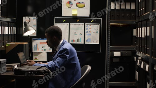 Preview: Policeman sits at desk with minicomputer
