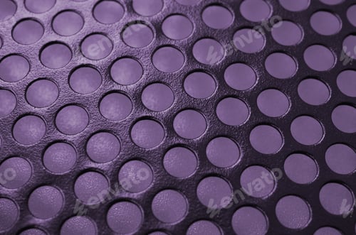 Preview: Black metal computer case panel mesh with holes on purple background. Abstract close up