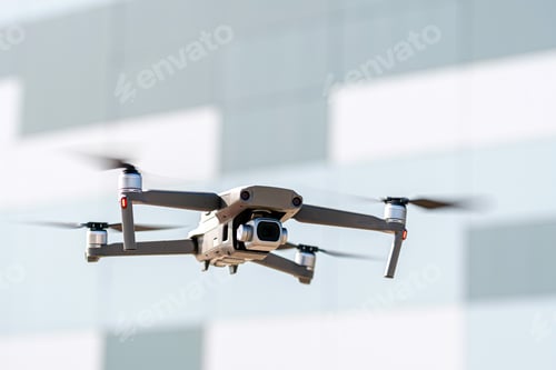 Drone Technology Flying in front of Modern Building