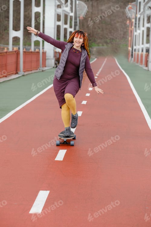 Preview: woman riding on the skateboard on the road