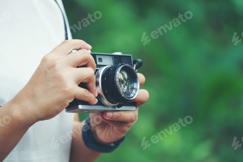Preview: woman with vintage camera