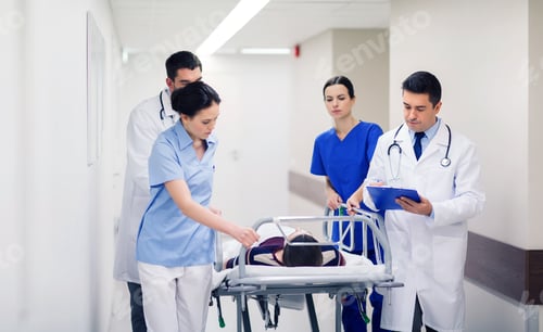 Preview: medics with woman on hospital gurney at emergency