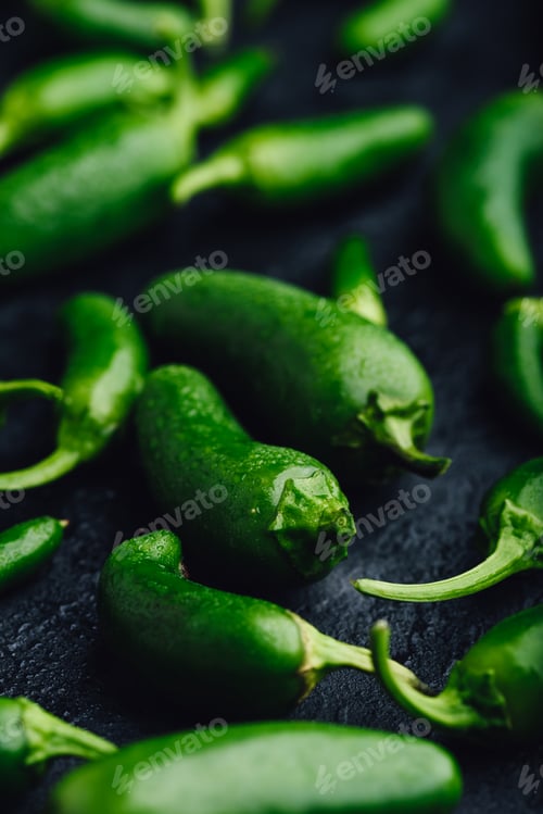 Preview: Green Jalapeno Peppers on Concrete Background