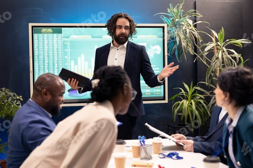 Preview: Team of associates working on resource allocation initiatives during a conference
