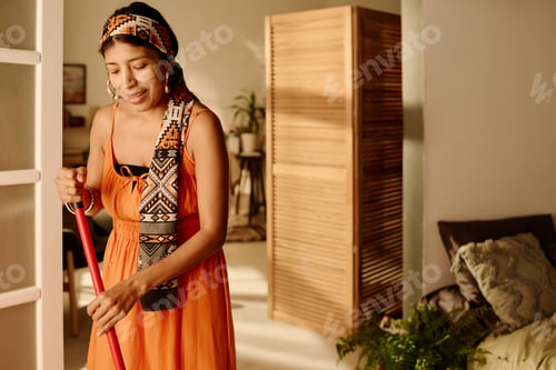 Preview: Girl with broom doing domestic chores