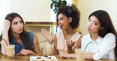 Preview: Annoying talkative friend sitting in cafe with girls