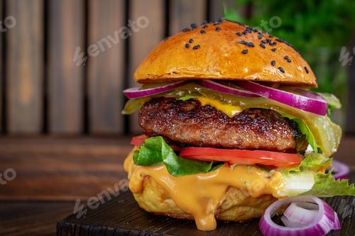 Preview: Sandwich with beef burger, tomatoes, cheese, pickled cucumber, red onions and ketchup. Cheeseburger
