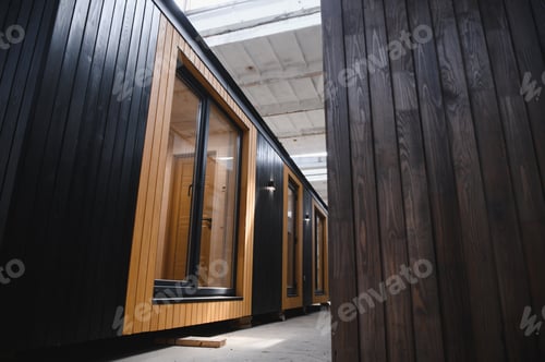 Preview: A new wooden modular prefabricated house inside in manufacturing facility