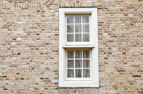 Preview: white wooden window on brick wall