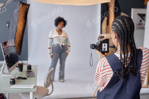 Preview: Woman Taking Photos in Studio