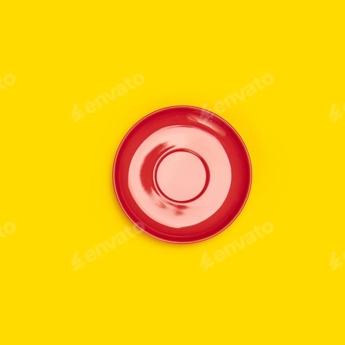 Preview: Top view of red ceramic plate saucer on yellow background