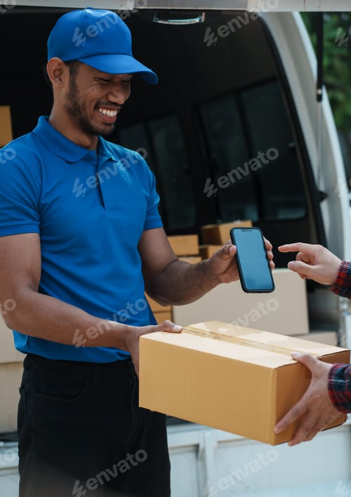 Preview: Delivery man handing parcel box to customer, percel box being paid with contactless nfc payment with