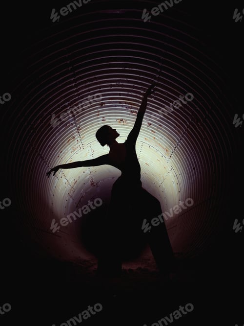 Preview: Silhouette of female ballerine dancer in darkness