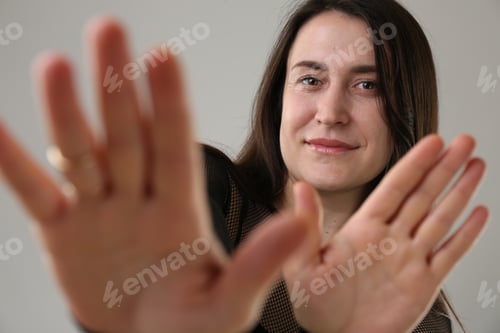 Preview: Beautiful young woman on light grey background