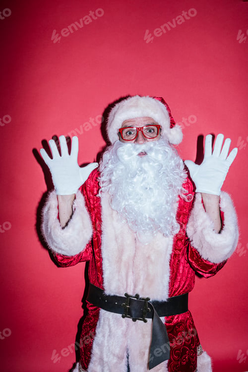 Preview: Man dressed as Santa Claus gesturing with funny glasses