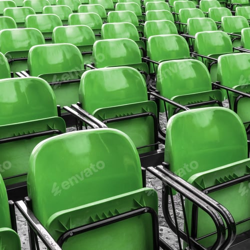 Preview: Empty plastic green chairs