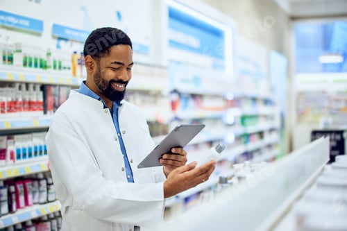 Pharmacist Using Digital Tablet in a Modern Pharmacy for Inventory Management