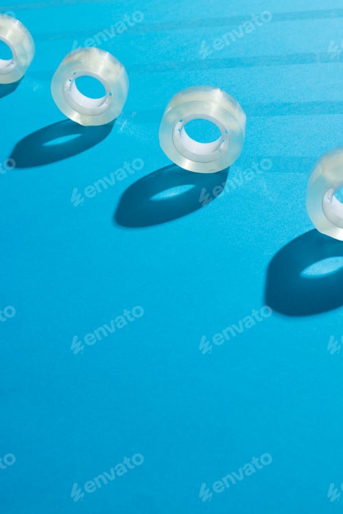 Preview: Rolls of transparent masking tape with copy space on blue background