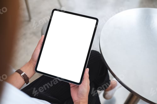 Preview: Mockup image of a woman holding digital tablet with blank white desktop screen
