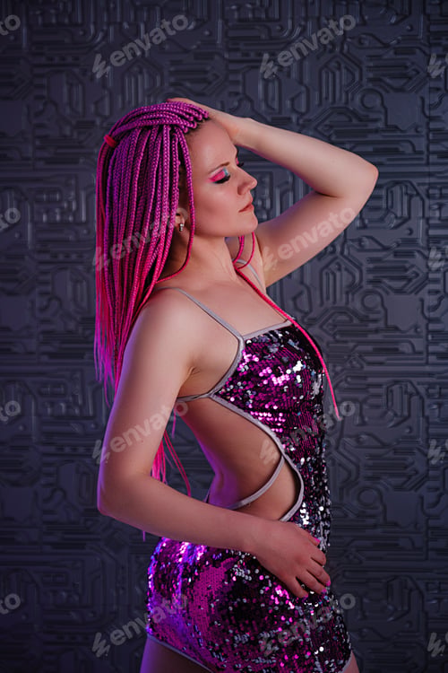 Preview: Attractive dancing woman with trendy pink braids in the club, neon light.