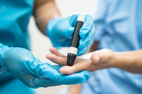 Preview: Doctor check diabetes from finger blood sugar level with finger lancet.