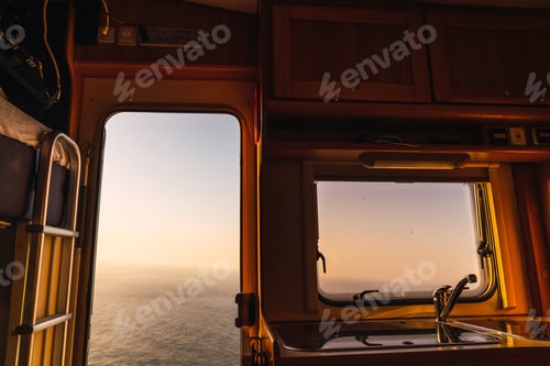 Preview: Retro camper van and picturesque view of sea