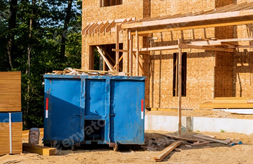 Preview: Dumpster, recycle waste and garbage bins near new construction of appartment houses building