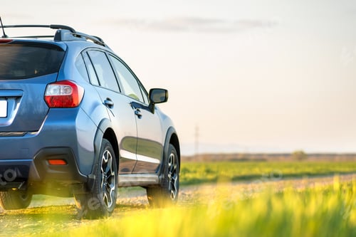 Preview: Landscape with blue off road car on gravel road. Traveling by auto, adventure in wildlife