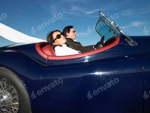 Preview: Couple in an old convertible