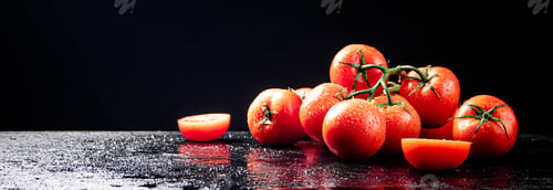 Preview: Ripe tomatoes on a branch and tomato halves.