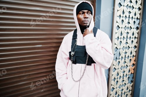 Preview: Stylish urban style african american man in pink hoodie