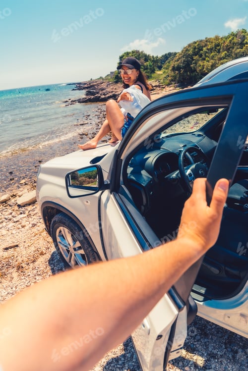 Preview: first person point of view man closing door of the car woman sitting on the hood