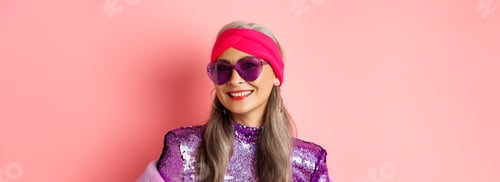 Preview: Fashion. Close up of stylish senior woman smiling happy at camera, wearing sunglasses and disco